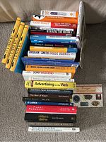 Stack of 33 marketing and sales related books shown from the front, titles visible on spines