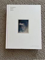 Front cover of the book showing title 'imagine john yoko' and centered photo of John Lennon.