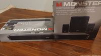 Box showing Monster Home Theater Bluetooth 5.1 Channel Soundbar with Wireless Subwoofer and images of soundbar and subwoofer.