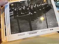 Photo showing black and white studio still from The Confession with men in uniform seated in courtroom