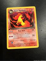 Dark Rapidash Pokémon card from Team Rocket 1st Edition set in near mint condition with bright colors.