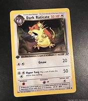 Dark Raticate 1st Edition Team Rocket Pokémon card showing 50 HP, attacks Gnaw and Hyper Fang with first edition symbol and Team Rocket logo.
