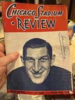 Front cover of the 1945 Chicago Blackhawks hockey program showing a player portrait and the title Chicago Stadium Review.