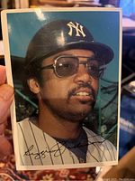 Color photo front of Reggie Jackson wearing New York Yankees cap and uniform, signed facsimile, 5x7 size