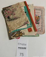 Lot of stacked vintage greeting cards showing various floral birthday card on front with pink roses and gold lettering