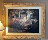 Full view of the framed art print showing a flower garden and white porch with door.