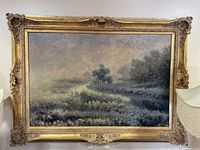 Frontal view of the oil painting in ornate gold frame showing impressionist landscape scene.