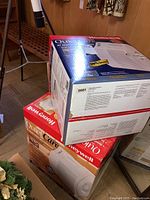 Two Honeywell Quiet Care air purifiers in original boxes stacked, showing model numbers.