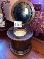 Open commode showing interior glazed chamber pot, hinge and seam area