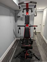 Front view of assembled Bowflex Xtreme PR3000 showing bench, pulleys, overhead arms and power rod tower