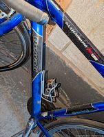 Close-up photo of the Denali bike frame showing the brand and Aluminum Pro Alloy labeling on the blue and black frame.