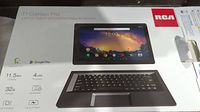 Box showing product image and key features like 11.5 inch display, 4 core processor, 32GB storage, touch screen, Android 9.0 OS