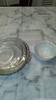 Clear glass pie dishes and rectangular baking dish on table
