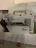 Bernina Matic 25 sewing machine and lower case with handle, My Bernina Guide visible
