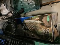 Photo showing the packaged animal trap box with a picture of a raccoon and the cage trap in an outdoor setting.