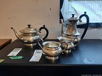 Overview of all five pieces on black surface