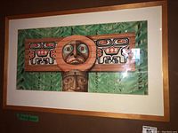 Framed artwork showing indigenous stylized abstract totemic elements and signed Art Dudley Davey 2000.