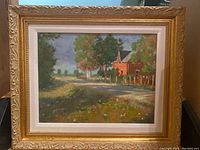 Full view of framed oil painting showing landscape scene