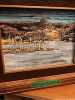 Oil or acrylic landscape painting by L Brodin featuring body of water and trees in wooden frame.