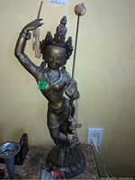 Full front view of 24-inch bronze-toned goddess statue on lotus pedestal