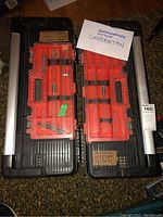 Top view of two Black & Decker 26 inch construction toolboxes side by side with removable red organizers and labels indicating contents.