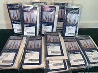 12 white semi sheer curtain panels in original packaging labeled Open Home Seed Window Fashions