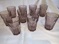 Ten pink faceted Libbey Gibraltar tumblers arranged in two rows showing shape and color.
