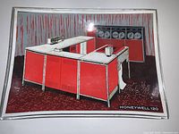 Front view of the glass dish with reverse painted Honeywell 120 computer system in red, white, and black.
