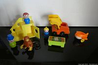 All eight toys arranged on black surface showing all included items in the lot