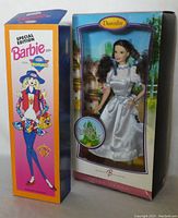 Dorothy Barbie doll in original box with black dog Toto, showing Wizard of Oz branding.