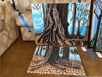 Both artworks shown together leaning against a chair to illustrate size and content with detailed tree trunks, roots, and blue sky backgrounds.