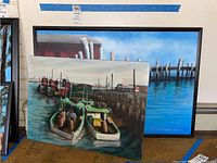 Overview of both paintings leaning against wall