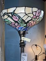 Full floor lamp including colorful stained glass shade and brushed metal base with decorative details, showing height marker of 70 inches.