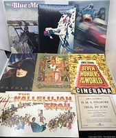 Main photo showing 9 large press books including The Blue Max, Marooned, Grand Prix, Napoleon, Camelot, Seven Wonders of the World in Cinerama, The Hallelujah Trail, and an H.M.S. Pinafore pamphlet.