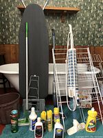 Ironing board, shoe rack, cleaning supplies in bucket, Swiffer mop, plate rack