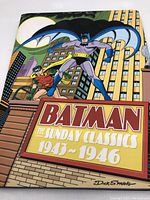 Front cover featuring Batman and Robin with city backdrop and title text.