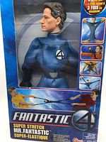 Front view of sealed Super Stretch Mr. Fantastic toy in original box showing facial details and Fantastic Four logo on chest.