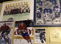 Collection of Toronto Maple Leafs and Montreal Canadiens autographed items including Stanley Cup finalists team photo and signed player photos.