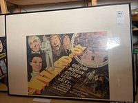 Full view of the framed Wizard of Oz movie poster showing the entire poster and frame.