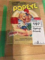 Full view of the front box of the Popeye video game cartridge showing complete artwork and branding.