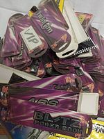 Pile of new car decals in factory packaging stacked with text including VIP, ABS, and BLITZ Power Book