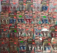 Overview of various packs of Moto Sports Type R LED light bulbs showing red, blue, and clear bulb pairs in packaging spread across a flat surface.
