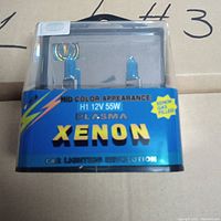 Front view of one H1 12V 55W Plasma Xenon headlight bulb in factory packaging with label visible.