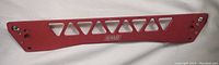 Red BWR rear subframe brace with triangular cutouts and BWR logo, and mounting holes at each end.