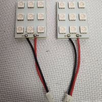 White square LED panels with multiple diodes and red/black wires
