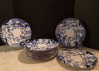 Front view of all 11 plates stacked and displayed