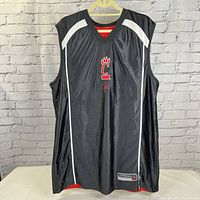 Front view of black side of reversible Cincinnati Bearcats Nike sports jersey with white piping and red Bearcats claw logo.