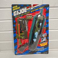 Front view of the sealed 1992 GI Joe Ocean Enforcer Mission Gear in original blister pack showing spear gun, flippers, and other scuba gear.