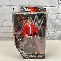 Front view of Hunter Hearst Helmsley WWE Elite action figure in red jacket, still in original WWE Network Spotlight packaging with visible wear on box edges.