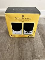 Box showing front view of Altec Lansing BX2 powered audio system speakers with product image and branding.